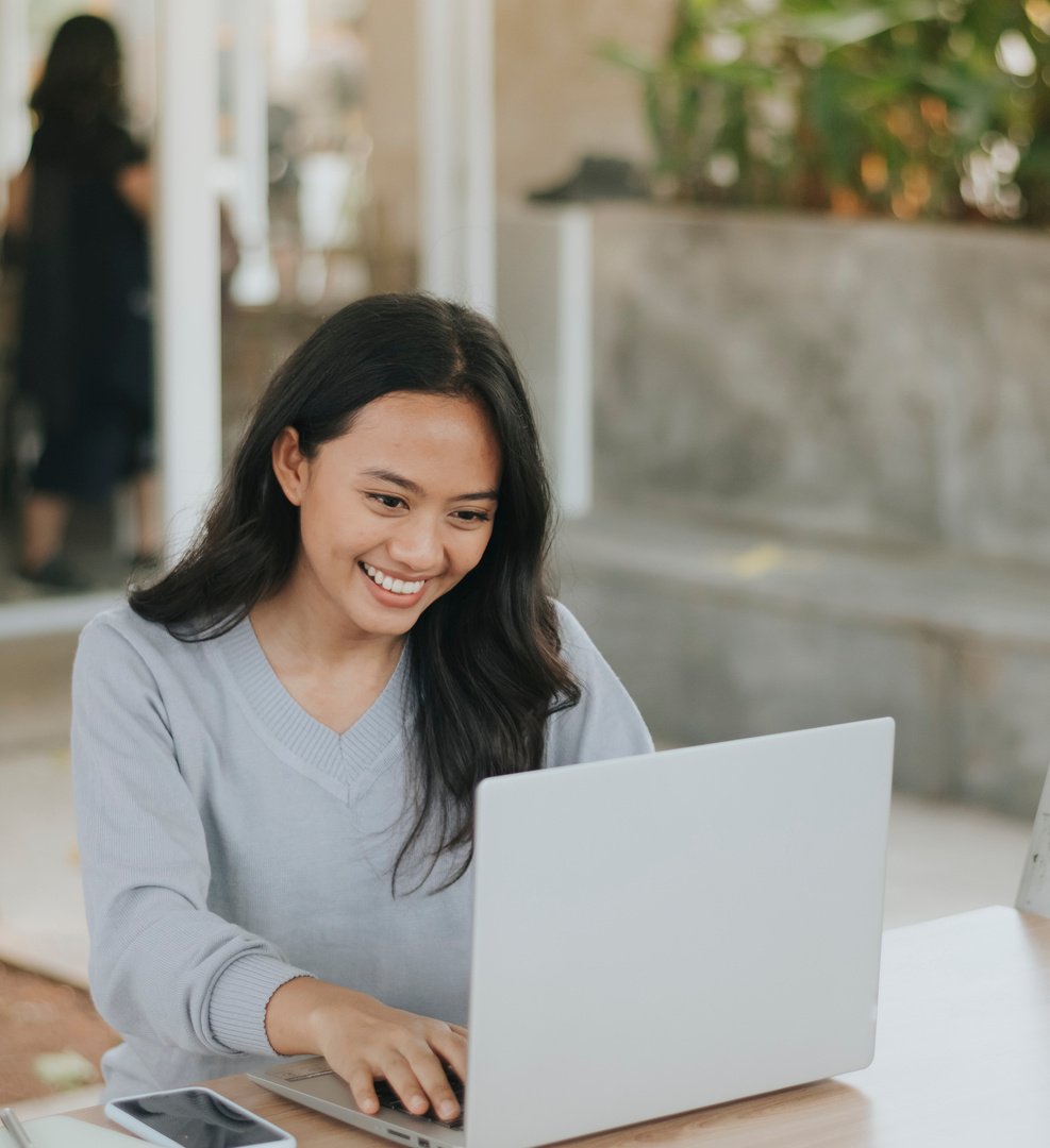 Woman Using Laptop Outdoors